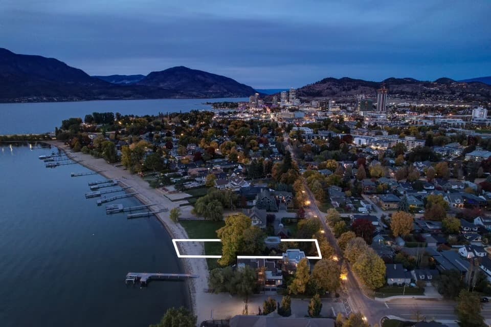 A TIMELESS BEACHFRONT COTTAGE WITH DOCK PERMIT ON ONE OF KELOWNA’S MOST SIUGHT AFTER STREETS